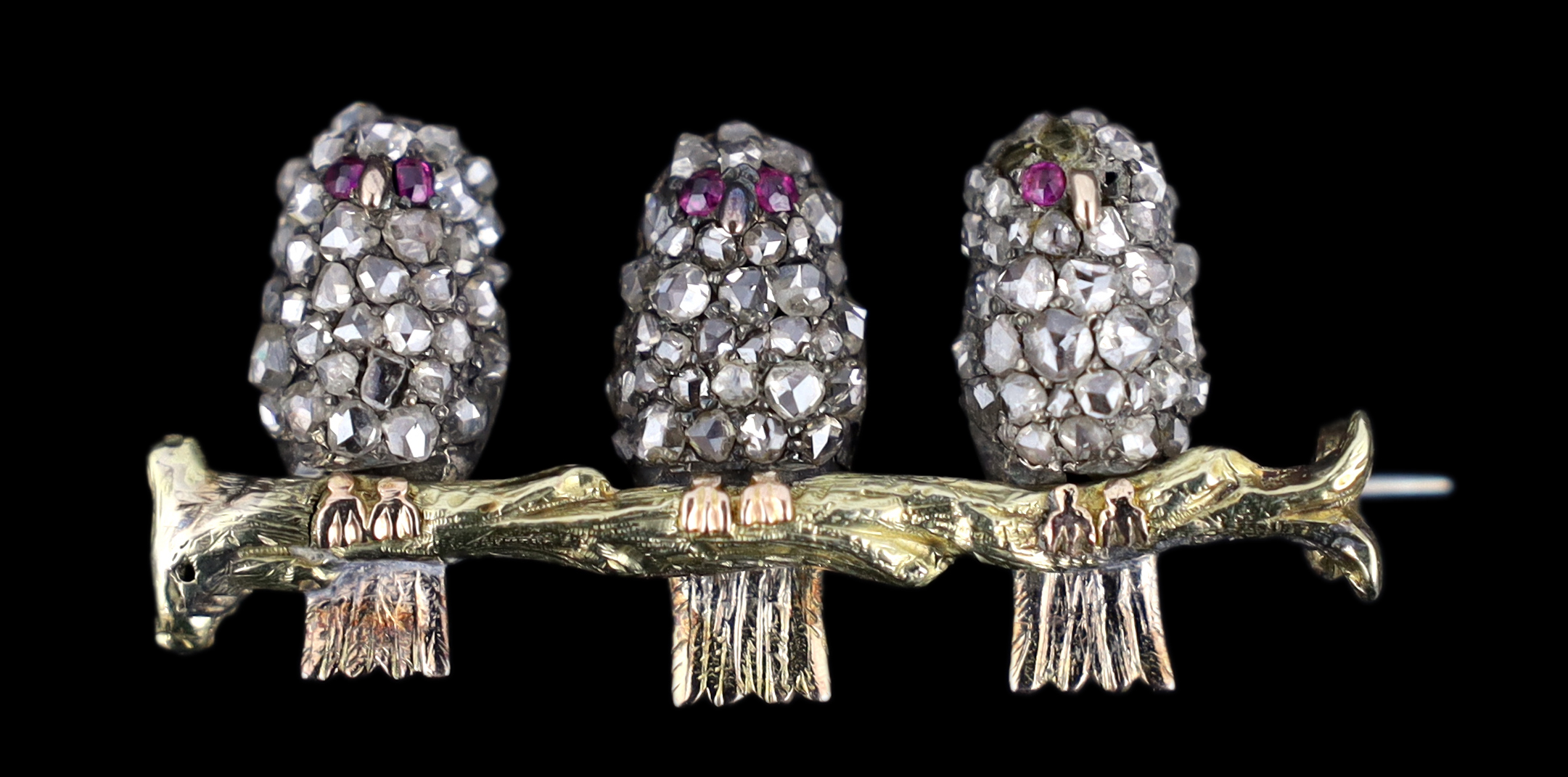 An antique gold, silver and rose cut diamond set novelty brooch, modelled as three owls on a branch